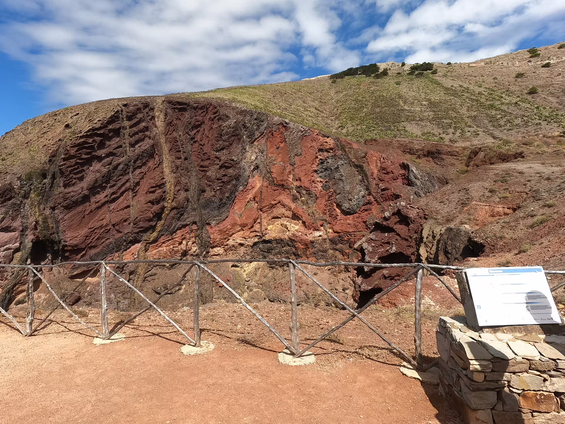 Explore the striking volcanic rock formations on Porto Santo's full island tour, showcasing unique geological landscapes.