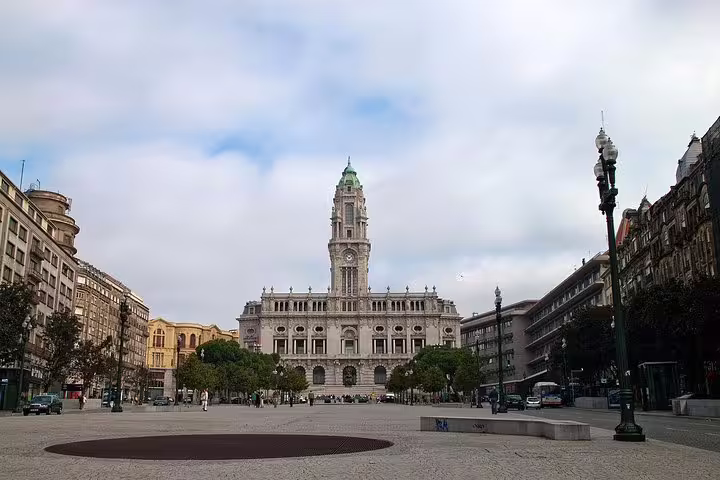 Explore Porto's iconic town hall on a half-day tour, featuring its stunning architecture and vibrant city square views.