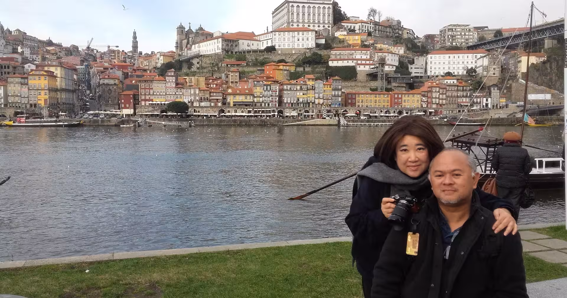 Travelers on the Douro River waterfront with Ribeira skyline, Porto small-group half-day walking tour with local guide