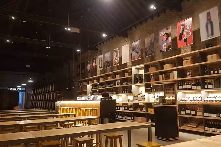 Modern Porto wine cellar tasting room with small-group tables, ideal for Half Day Porto & Beach Side tour