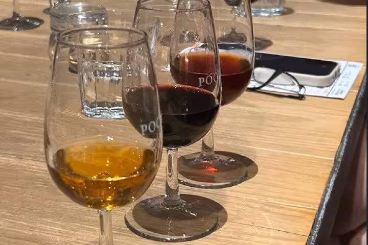 Porto tasting flight with white, ruby and tawny port glasses on table during Half Day Porto & Beach Side tour