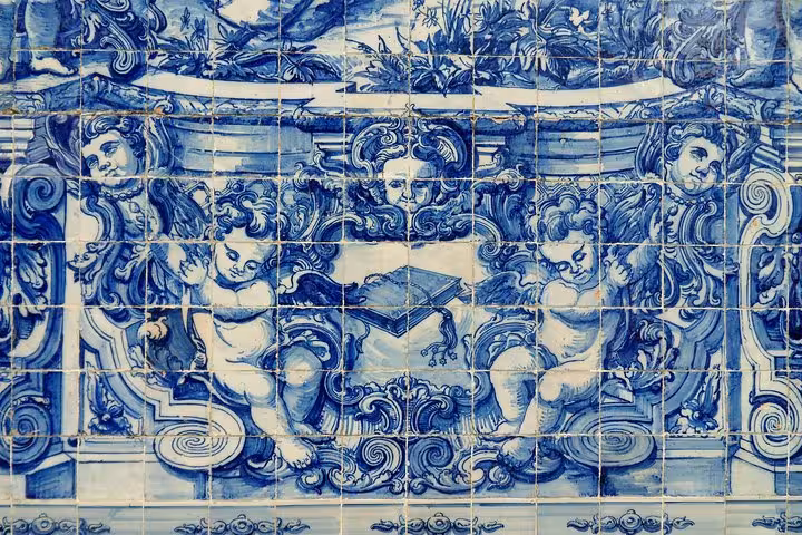 Close-up of traditional azulejos tiles in Coimbra, showcasing Portuguese art on the Porto tour itinerary.