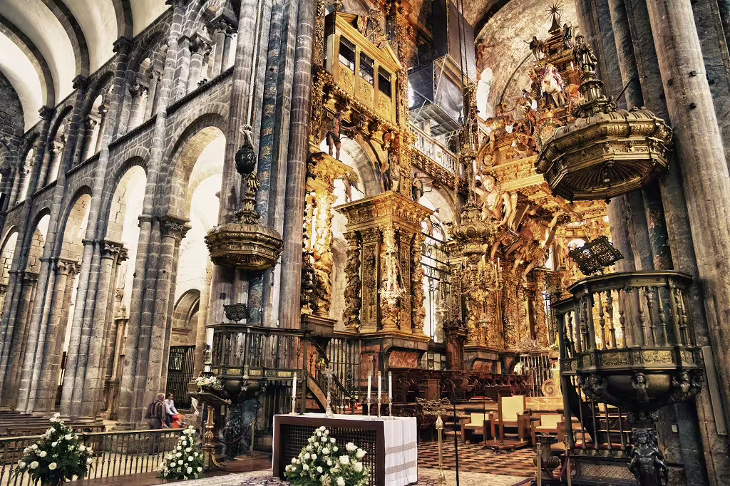 Ornate interior of a historic Portuguese cathedral showcasing intricate gold details, ideal for self-drive tours in Portugal.