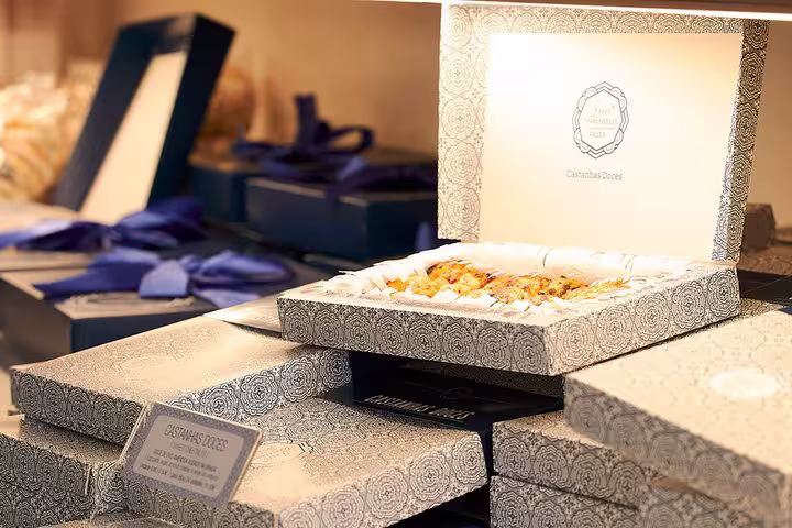 Elegant packaging of Portuguese pastries on display, highlighting local delicacies near the Paiva Walkways.