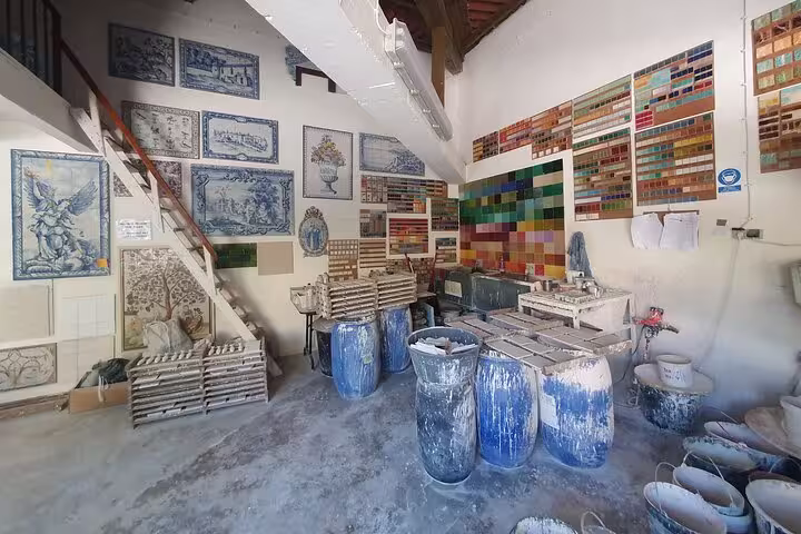 Traditional Portuguese tile workshop in Azeitão, displaying colorful azulejos and artistic craftsmanship.