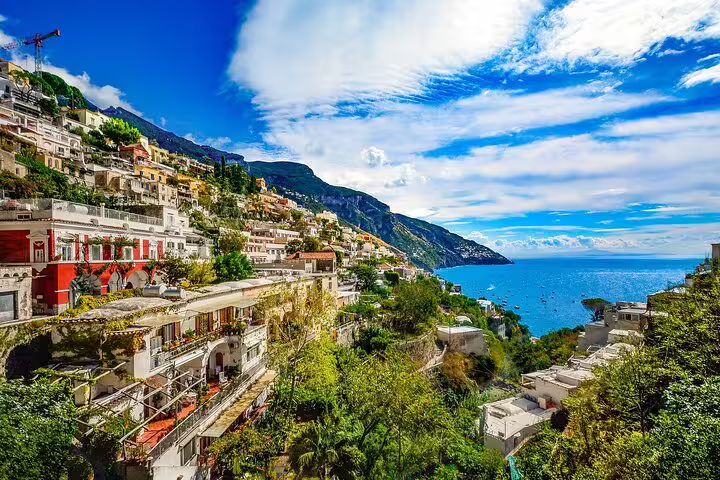 Colorful cliffside houses of Positano overlooking the Tyrrhenian Sea, a scenic stop on a weekly Amalfi Coast catamaran cruise