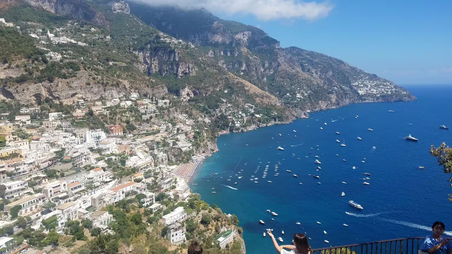 Positano cliffside view with boats on the Amalfi Coast, scenic stop on Pompeii tour from Naples group