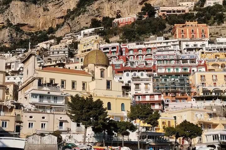Colorful hillside buildings in Positano, Italy, showcasing vibrant architecture on the Amalfi Coast.