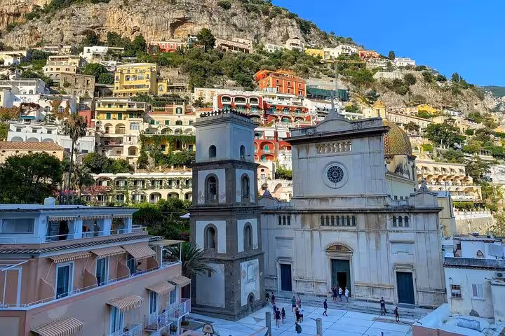 Scenic view of Positano's colorful hillside and historic church, a highlight of the private Amalfi coast tour.