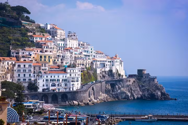 Breathtaking view of colorful Positano houses cascading down to the azure sea on the Amalfi Coast tour.
