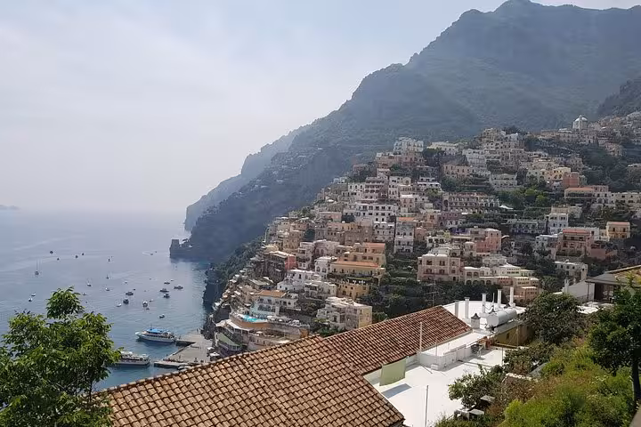 Panoramic view of Positano hillside houses and bay on Amalfi Coast tour from Rome with Sorrento stop