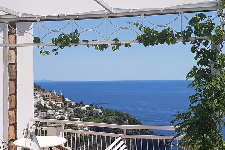 Sea-view terrace overlooking Positano on the Amalfi Coast, scenic stop on a day trip from Rome