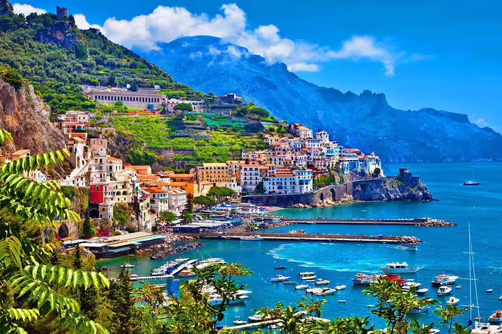 Positano panoramic bay with terraced hills and boats, highlight of Amalfi Coast VIP small group tour
