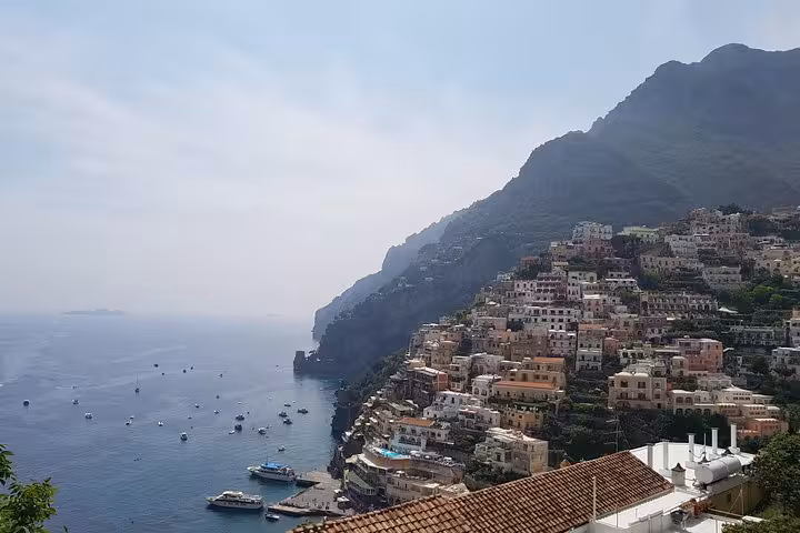 Positano cliffside houses above the Tyrrhenian Sea on Amalfi Coast full-day tour from Rome