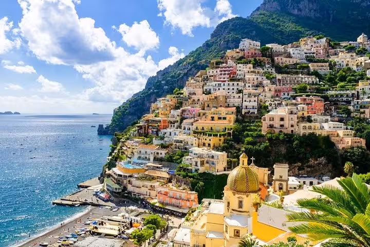 Breathtaking Positano hillside with colorful buildings overlooking the sea, featured in a private local tour.