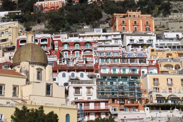 Colorful hillside buildings in Positano, Italy, seen on the scenic private transfer from Rome with Pompeii tour.