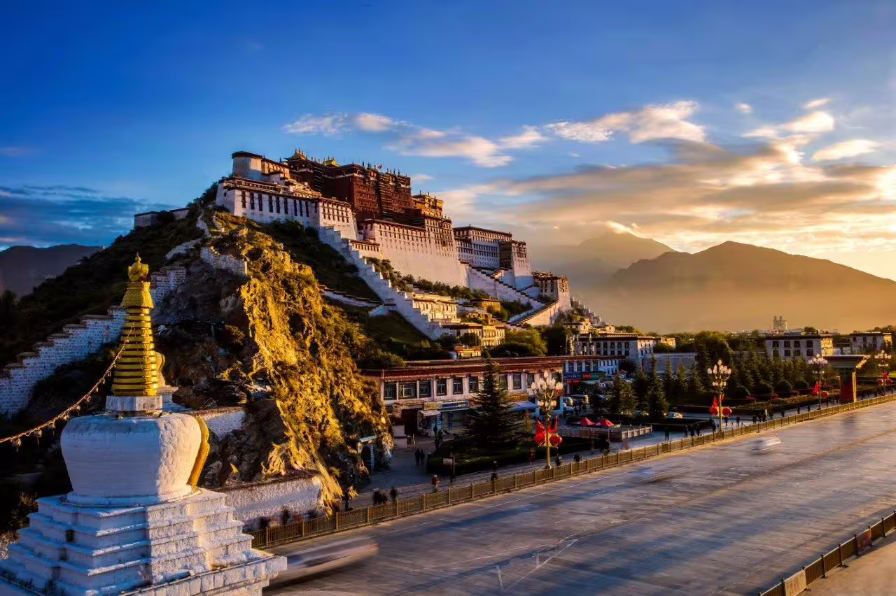 Potala Palace illuminated by sunset, a stunning architectural marvel in Lhasa, Tibet, rich in cultural history.