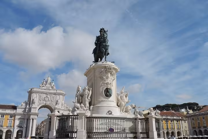 The iconic Praça do Comércio and equestrian statue in Lisbon, a highlight of the Porto, Coimbra, Fatima, Lisbon & Madrid tour.