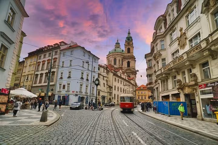 Prague Old Town street with tram at sunset, scenic highlight on a private day trip from Vienna