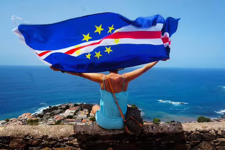 Traveler at seaside viewpoint in Cape Verde on guided Praia and Cidade Velha historic shore excursion tour