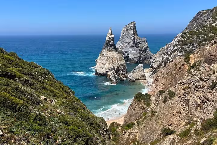 Stunning coastline view of Praia da Ursa's dramatic rock formations and turquoise waters on the Atlantic Coast near Sintra.