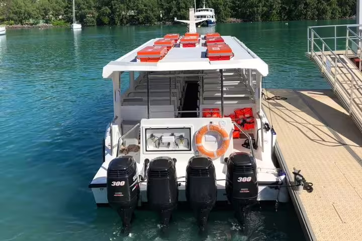 Spacious boat equipped with life jackets and powerful motors, ready for Praslin and La Digue shared day excursions.
