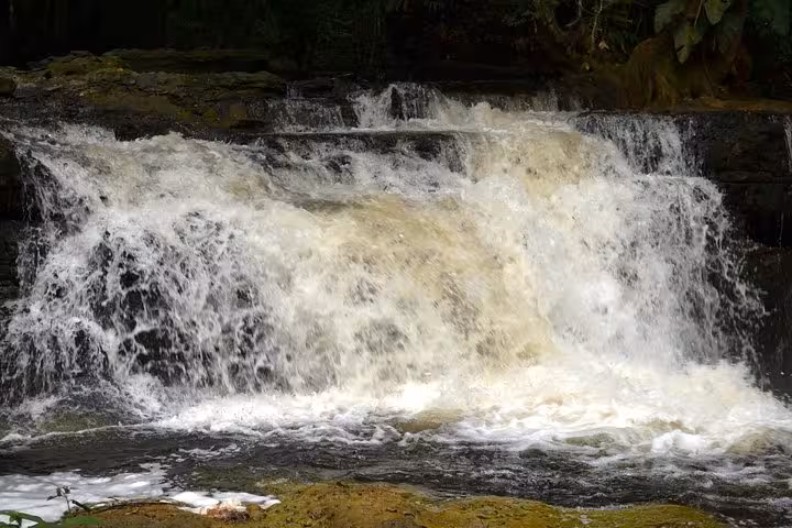 Wide cascade waterfall in Presidente Figueiredo Amazon, popular Manaus excursion for swimming and rainforest scenery