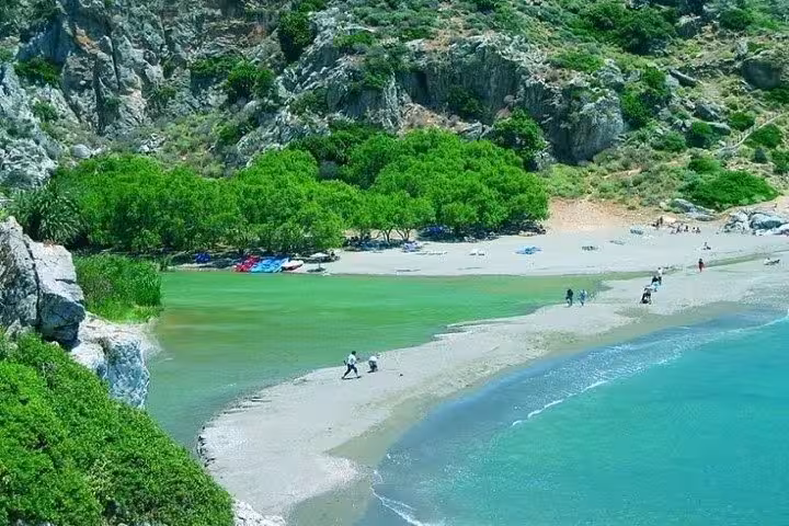 Preveli Palm Beach river mouth and sandy shore, South Crete excursion from Rethymno with crystal-clear water