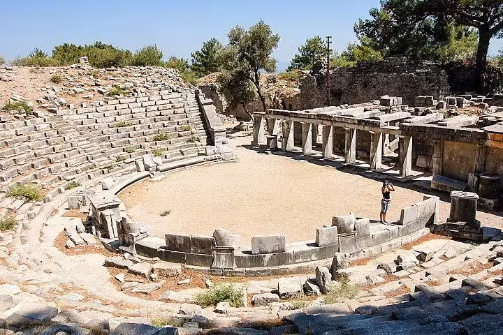 Ancient Priene theater ruins with stone seating on 3-day Ephesus Pamukkale Priene Miletus Didyma tour