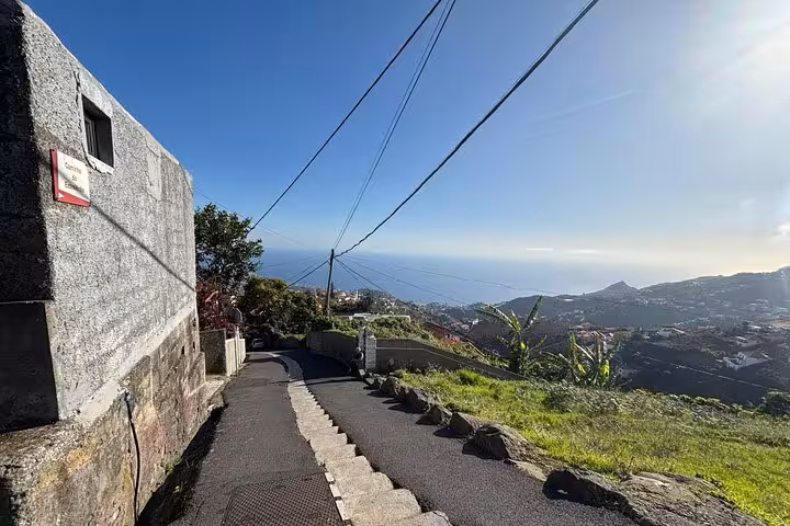Narrow hillside road overlooking the ocean and valleys, coastal viewpoint on a private 4x4 shore excursion adventure