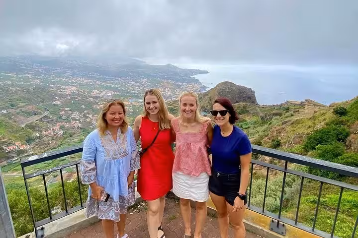 Friends at scenic viewpoint overlooking coastline on a private 4x4 shore excursion 4h adventure tour