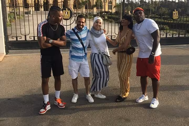 Group photo outside Montaza Palace gates during a private Alexandria day tour from Cairo with guide