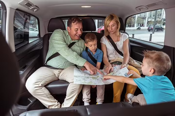 Family planning route in a private car on an Athens layover tour with airport or port transfer included