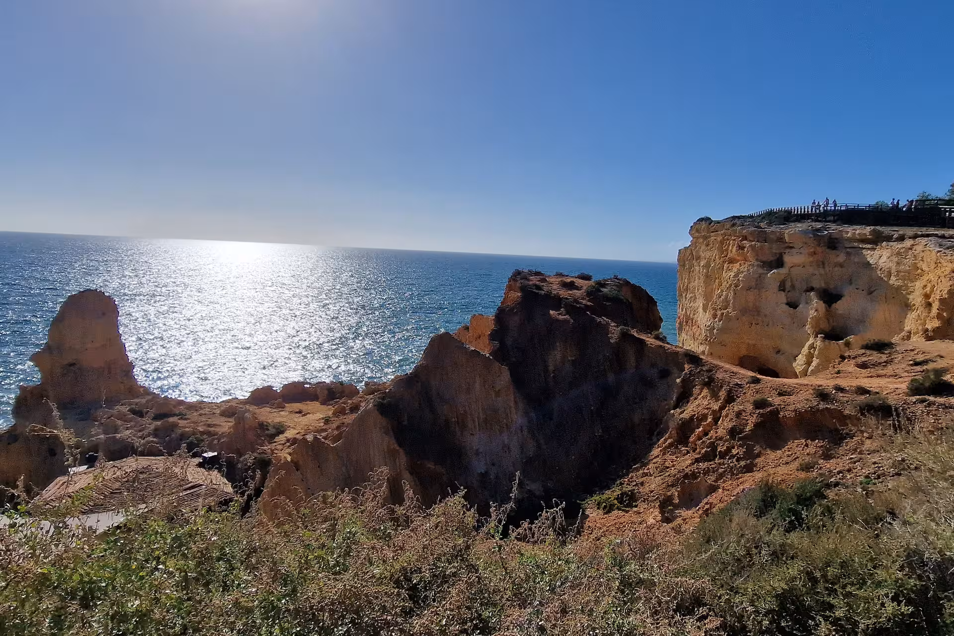 Stunning ocean view at the seven Hanging Valleys with rugged cliffs and sunlight reflecting on the sea.