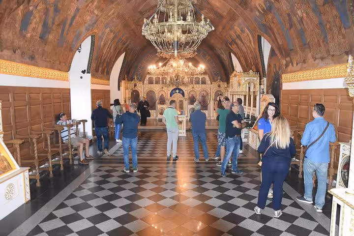 Visitors explore the ornate interior of a historic church on a private Belgrade neighborhood tour.