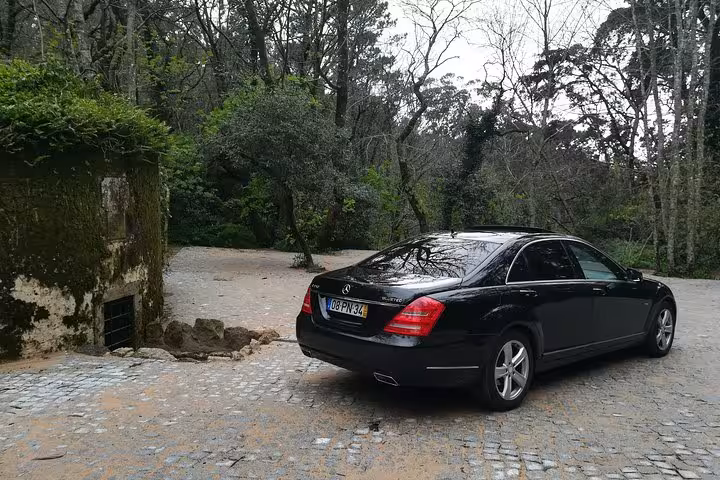 Private black sedan airport shuttle Lisbon city transfer, comfortable door-to-door ride from Lisbon Airport