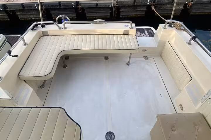 Spacious seating area on a private boat for a full-day Amalfi Coast tour, offering comfort and style.