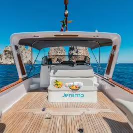Spacious Jeranto private boat for Sorrento to Amalfi transfer with sun deck seating and coastal views