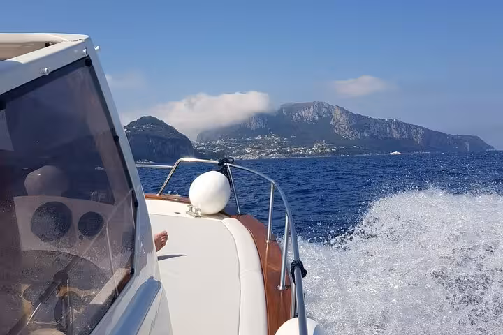 Experience a thrilling private boat ride with panoramic views of the Amalfi Coast's majestic cliffs and azure sea.