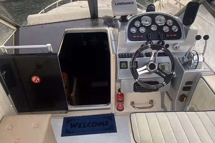 Cockpit view of a private tour boat with modern controls, ideal for navigating the Amalfi Coast.