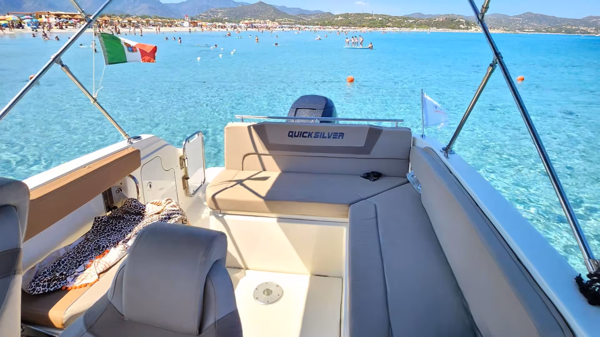 Relax on a spacious boat deck during a private Villasimius tour, offering stunning views of Sardinia's coast.
