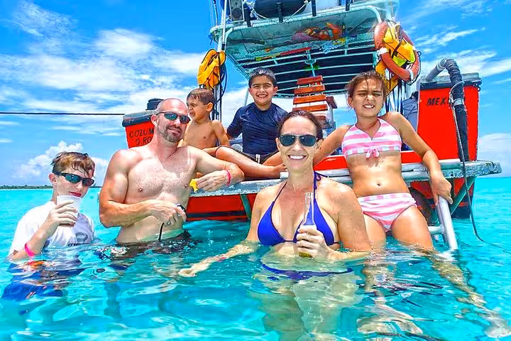 Family snorkeling stop in crystal Red Sea water on private boat trip from Hurghada to Sahl Hasheesh and Soma Bay