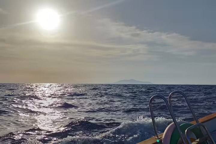 Sunset sea view from a private Capri boat tour with swim ladder ready for a refreshing dip in the Tyrrhenian