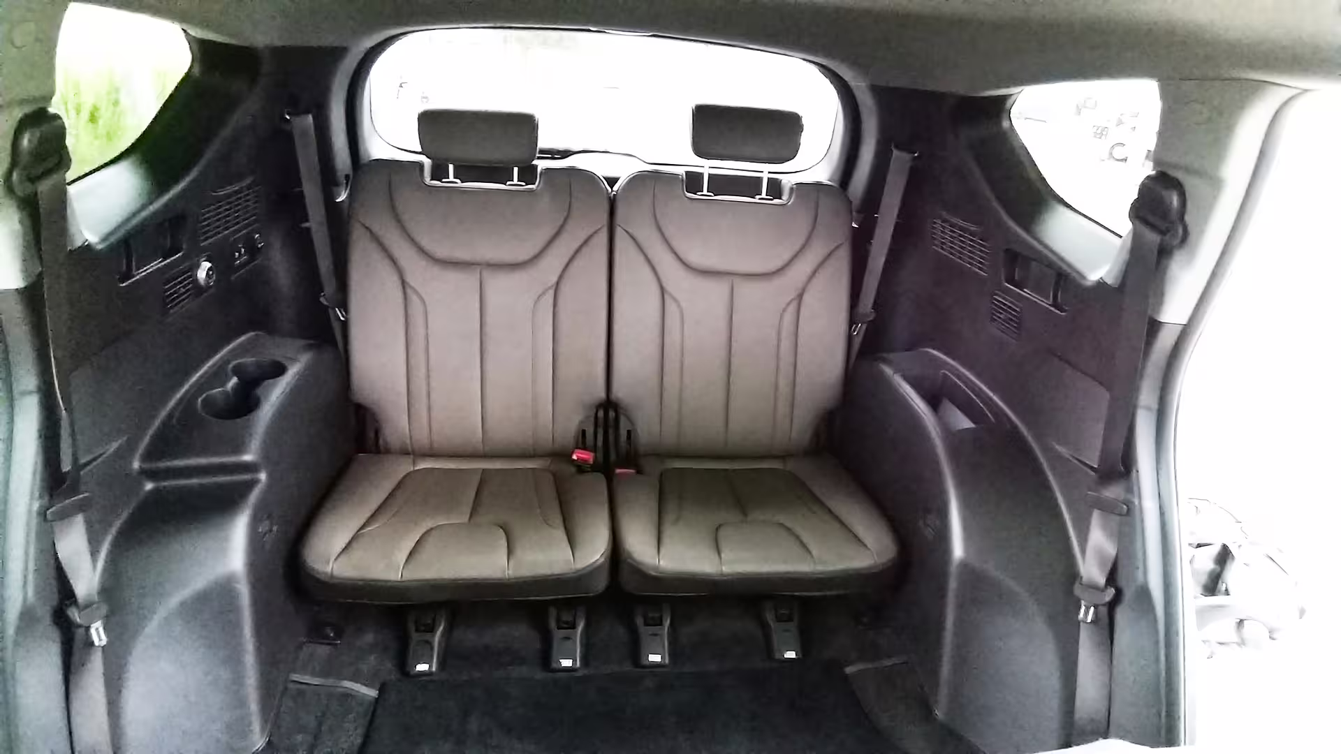 Comfortable back seat view in private car transfer from Porto to Castelo Branco, showcasing ample seating space.
