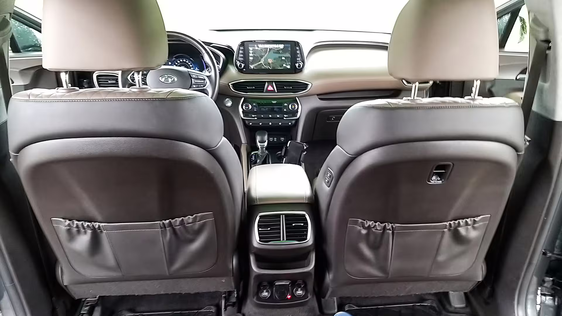 Interior view of a private transfer car showcasing modern dashboard and comfortable seats for Porto to Vila do Conde journey.