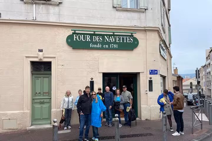 Tour guests outside Four des Navettes bakery in Marseille on a private Cassis and Marseille city tour
