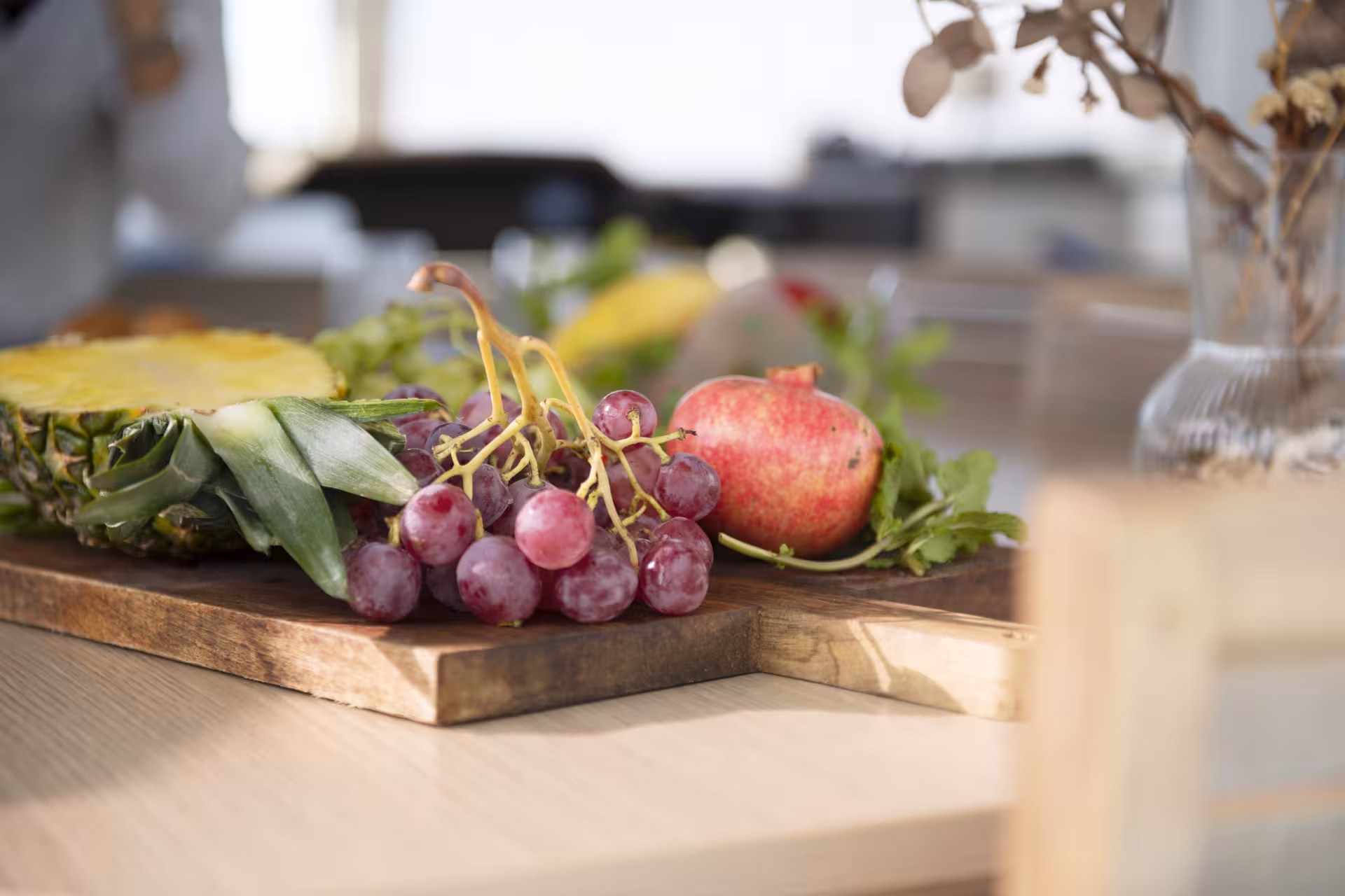 Fresh fruit platter with pineapple, grapes and apple prepared onboard for a private catamaran rental cruise