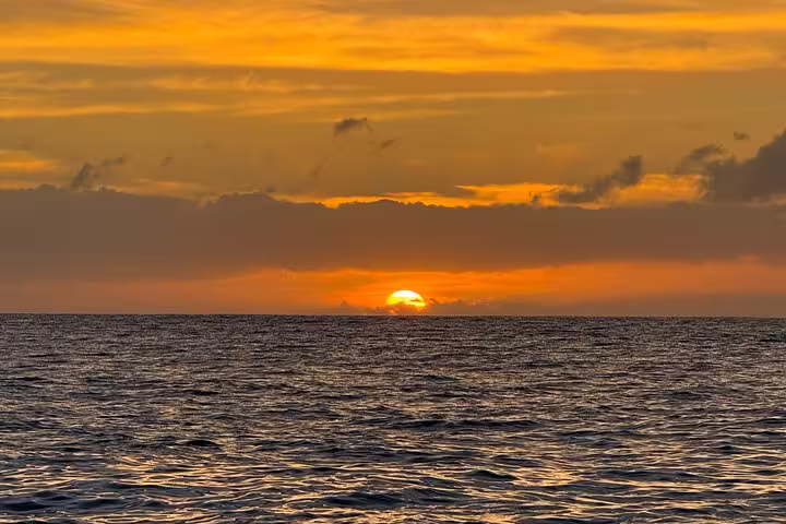Breathtaking sunset over the ocean horizon, perfect for a serene private cruise experience.