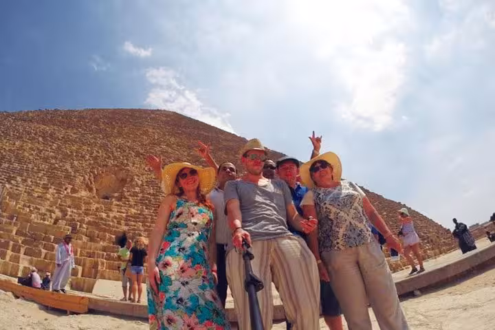 Group selfie at the Great Pyramid of Giza on a private day tour to Cairo from Hurghada, Makadi Bay and Soma Bay