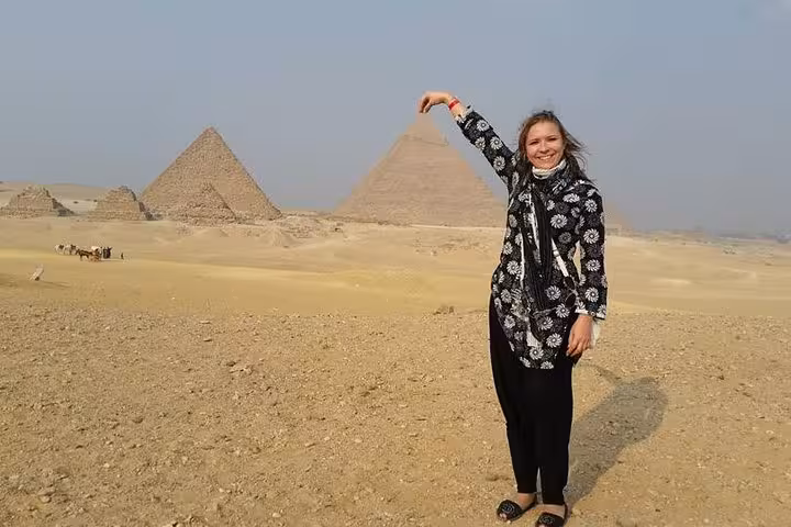 Traveler posing at Giza Pyramids on a private day tour to Cairo from Hurghada, Makadi Bay, Soma Bay, El Gouna